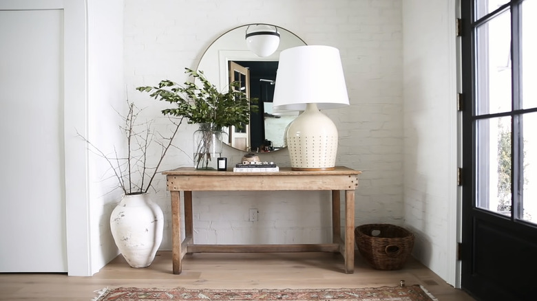 oversized lamp and vase in entryway