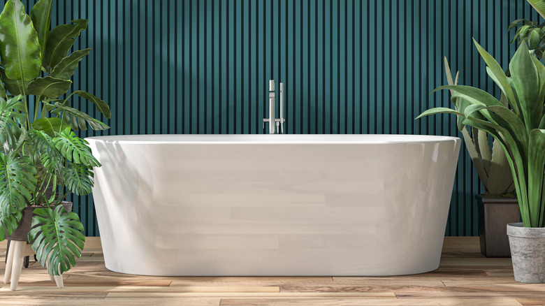 Bathroom with pine green wooden paneled wall 