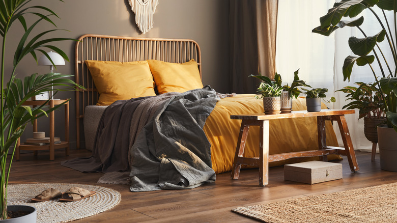 potted plants on bedroom bench 