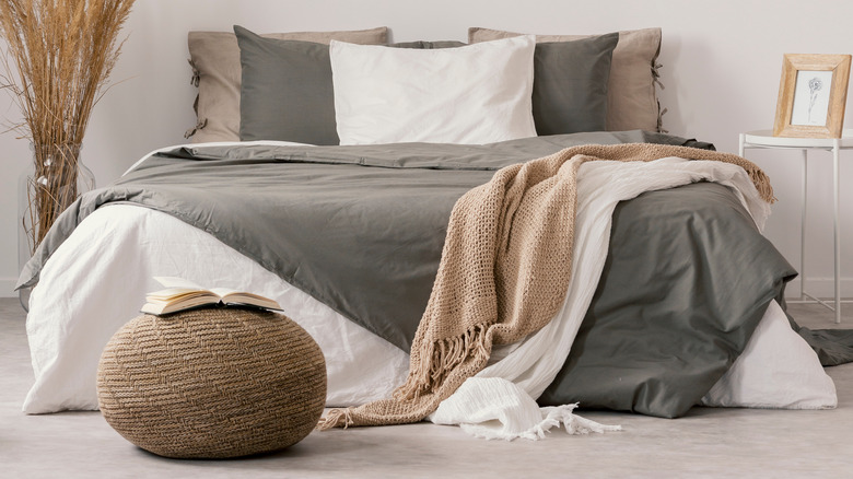 natural woven pouf in bedroom