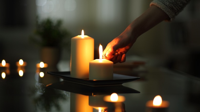 Woman lighting candles