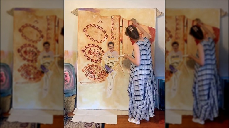 woman painting large canvas