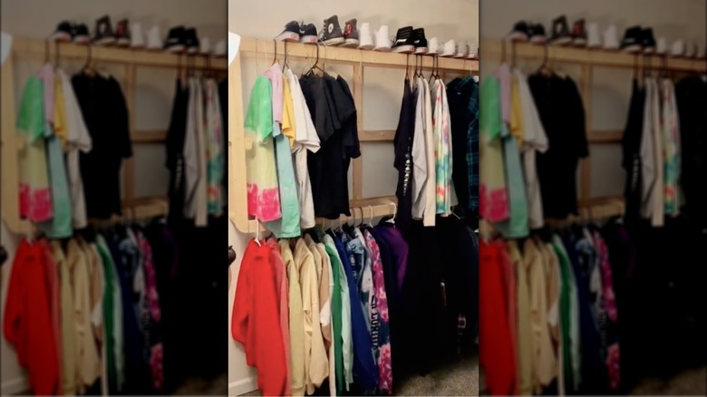 clothing hung on box spring frame