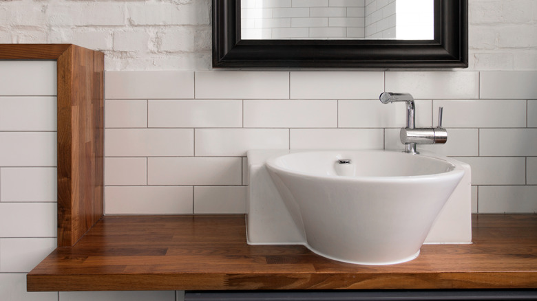 Bathroom using laminate countertops that look like real wood