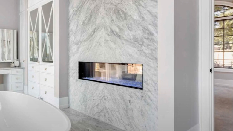 double-sided fireplace in bathroom