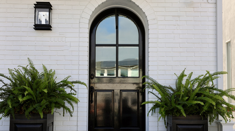 A black front door with a high gloss finish