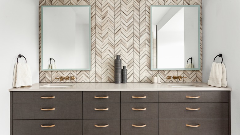 Vanity with herringbone wallpaper