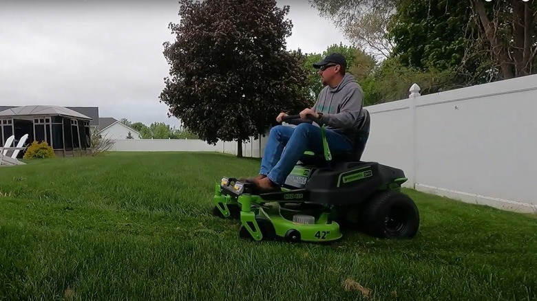 man using a Greenworks riding mower