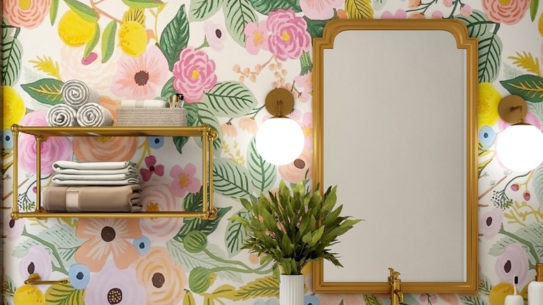 floral wallpaper and gold mirror