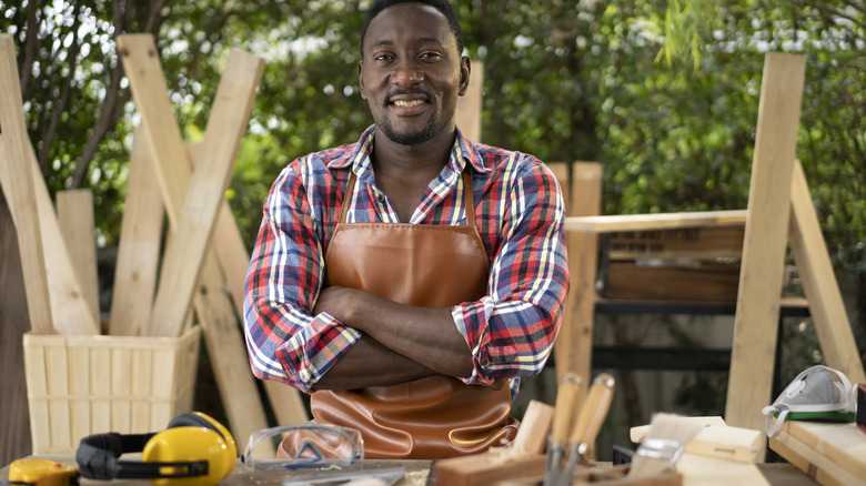 Carpenter with crossed arms