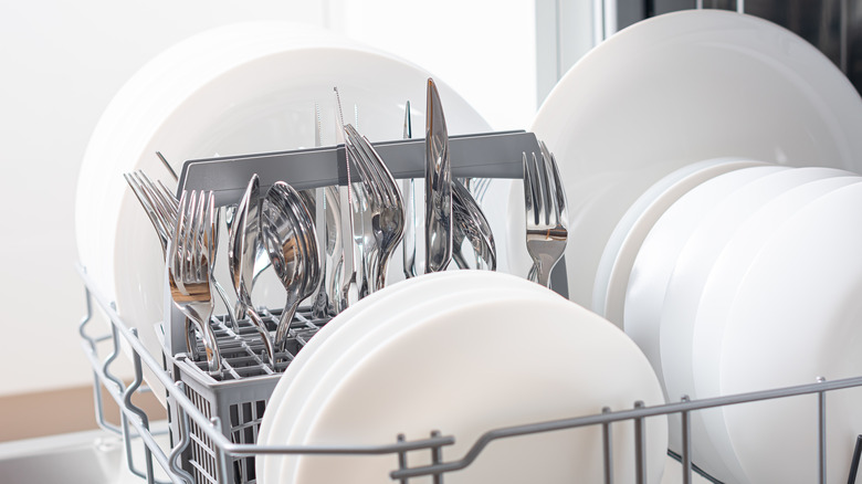 Dishes and utensils inside dishwasher