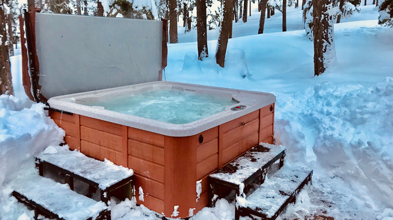 Hot tub surrounded by snow