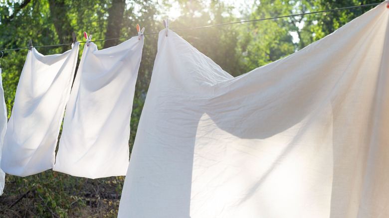 white sheets drying outside