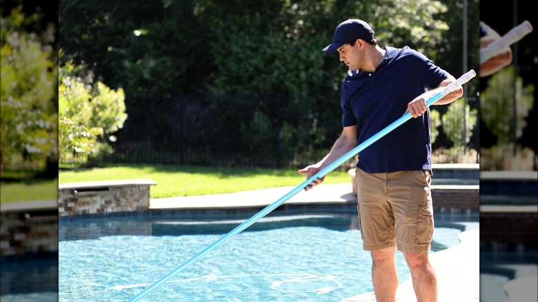 Man cleaning out a pool