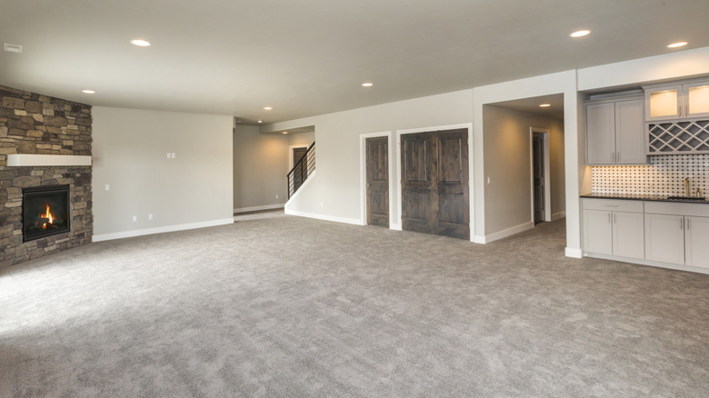 A basement with carpet