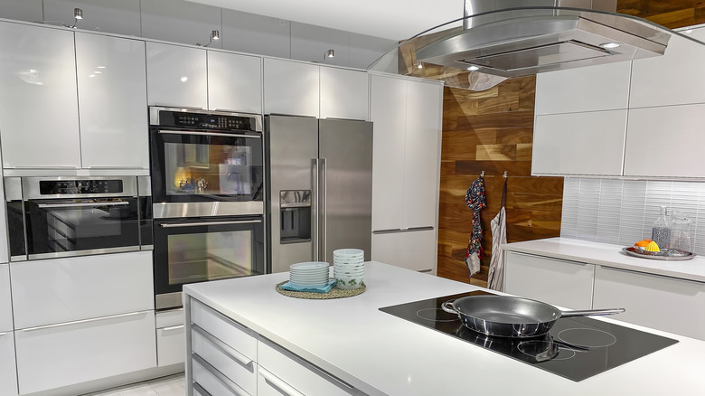 White kitchen island with electric cooktop