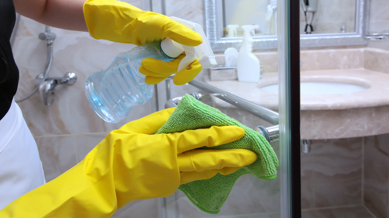 Spraying down shower door