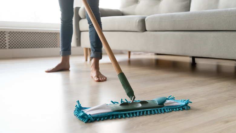 Person mopping laminate floor