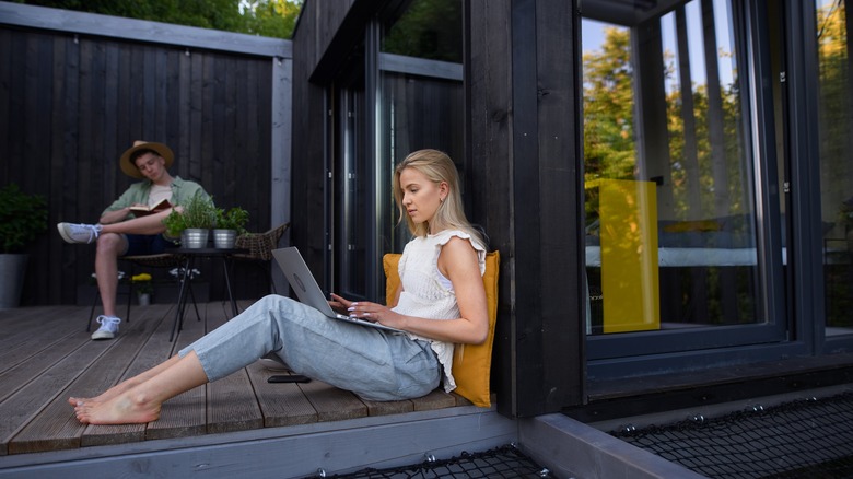 Woman and man sitting on patio