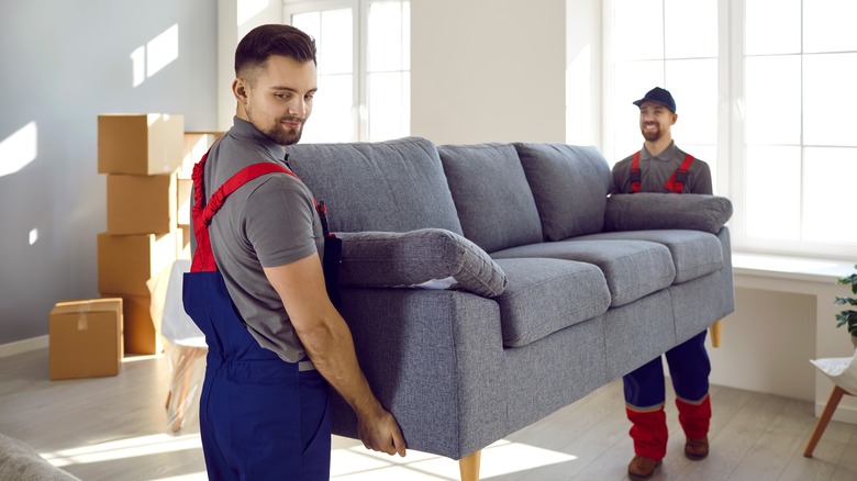 Men moving a couch