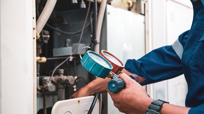 mechanic working on AC system