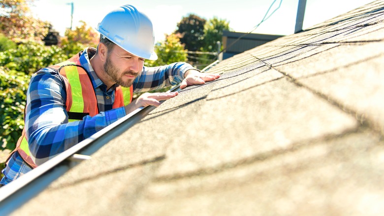 Contstruction worker adding a new roof