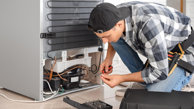 repairing broken fridge