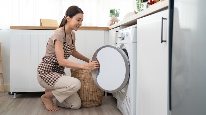 woman loading laundry