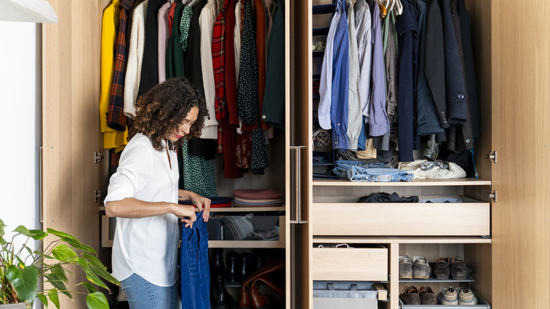 woman organizing closet