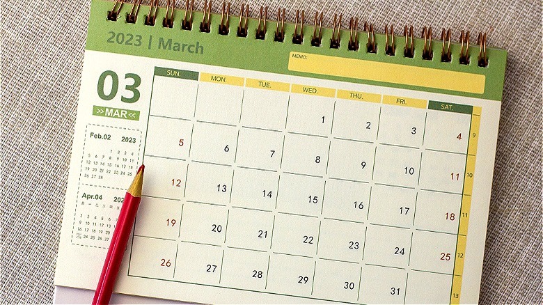 Red pencil on March calendar