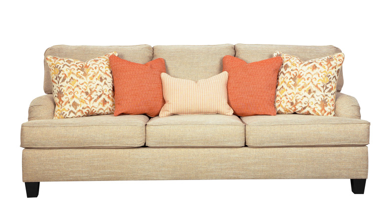 orange pillows on couch