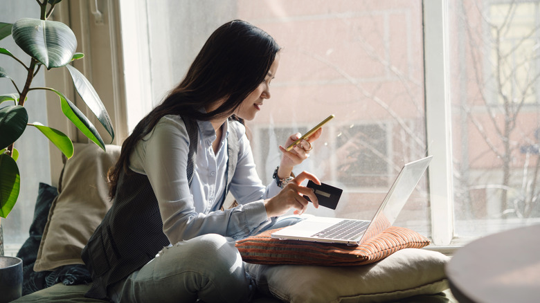 A woman shops on her computer