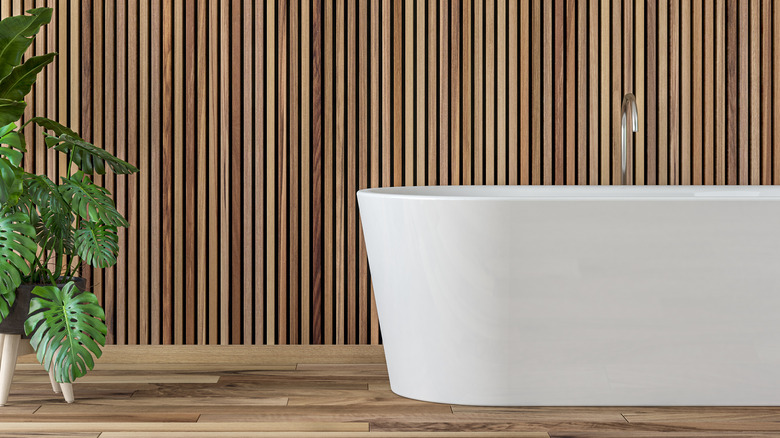 Bathroom with wood paneling 