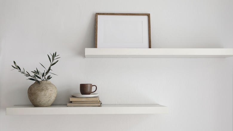 Home decor on two floating shelves 