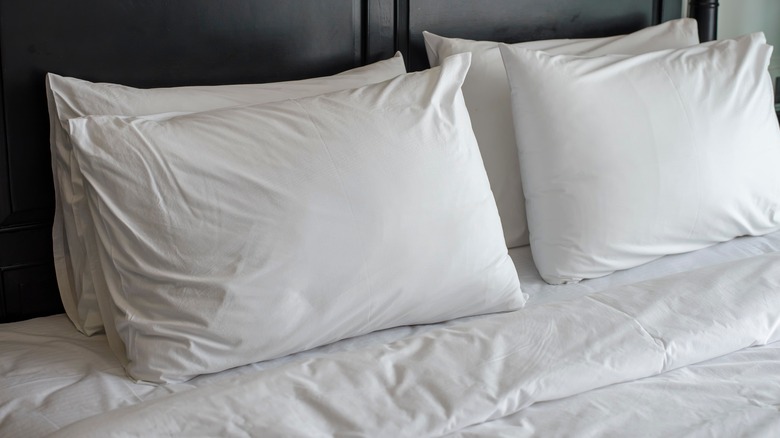 Pillows on made up bed