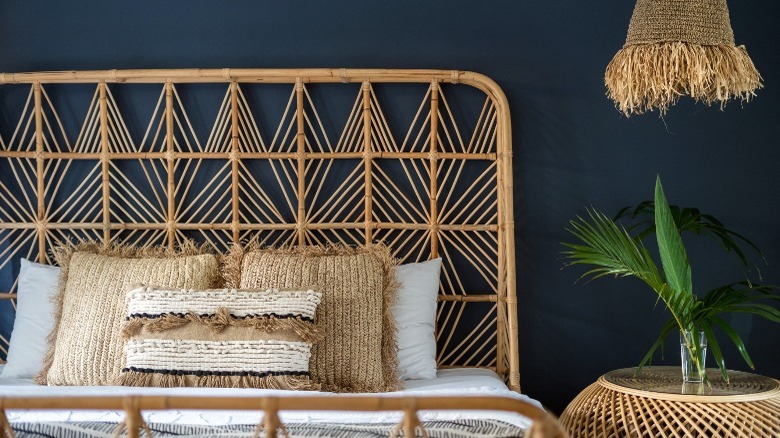 Rattan bed in bohemian bedroom