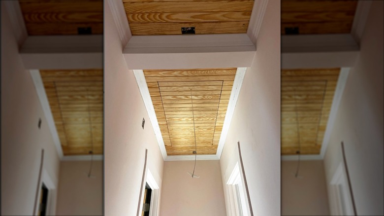 Wood paneled access door in ceiling