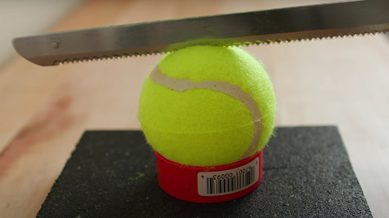 cutting a tennis ball 