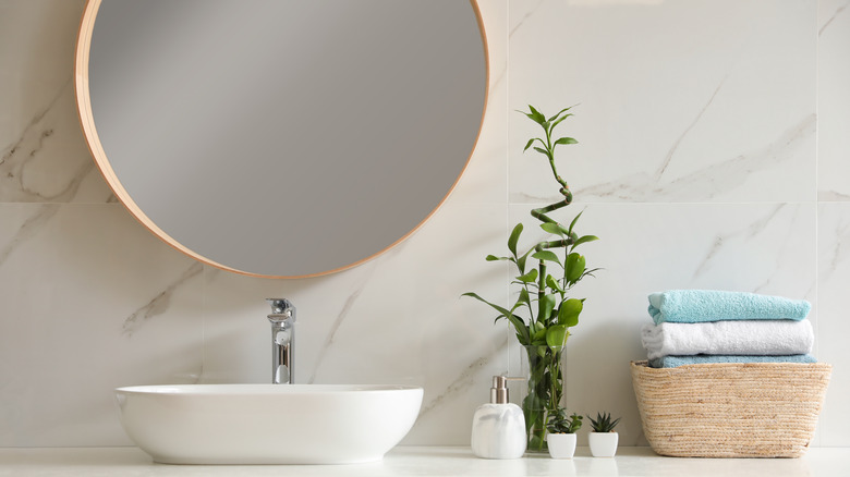 organized bathroom counter marble tile