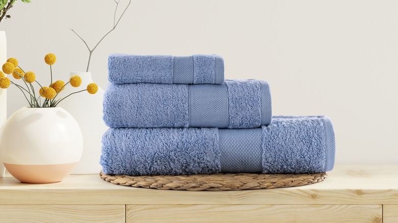 three plush blue bath towels