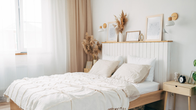 White bedroom with wood accents