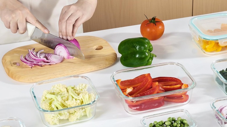 woman chopping vegetables for glass food storage containers