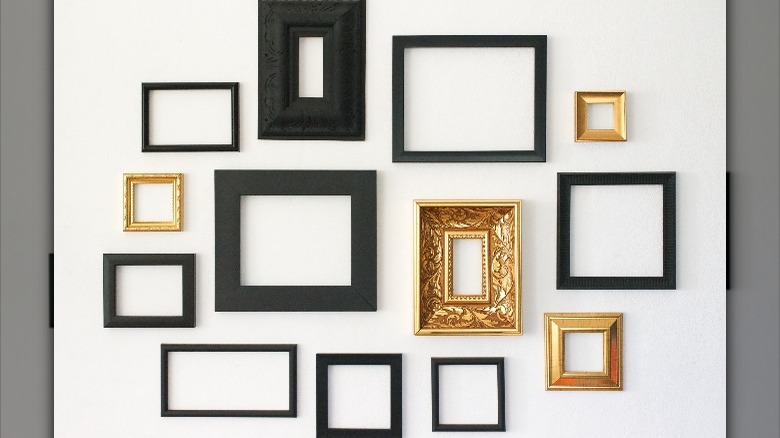 black and gold gallery wall