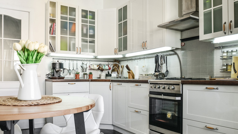 Small white kitchen with cabinets