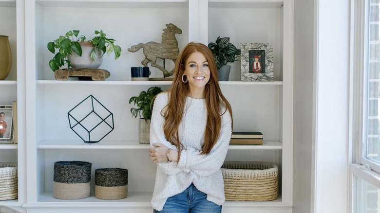 Jenn Todryk in front of shelves