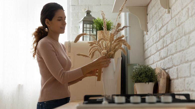 Person decorating kitchen counter