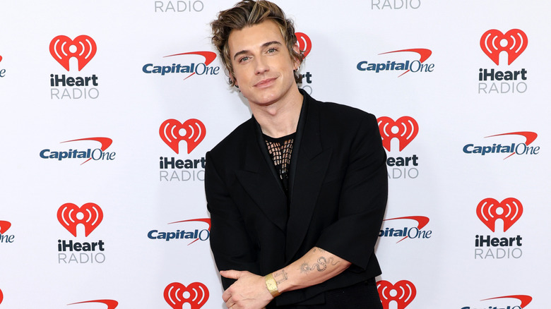 Jeremiah Brent smiling at the camera on the red carpet.