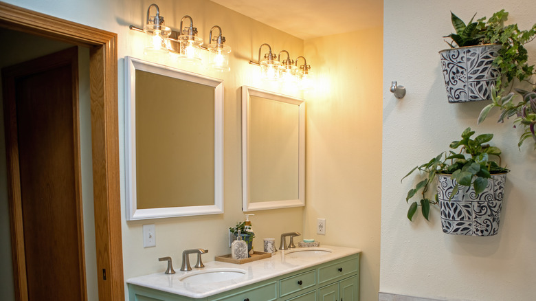 two small bathroom mirrors