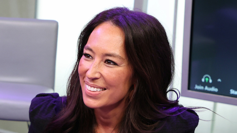 Joanna Gaines in a black shirt smiling