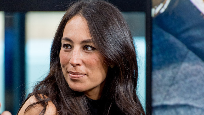 Joanna Gaines looks at speaker